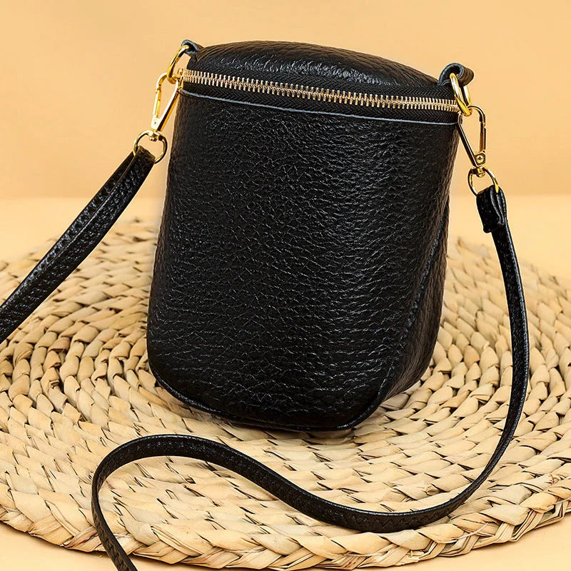 Premium leather crossbody bag with adjustable strap, multiple pockets, and sleek Korean-inspired style