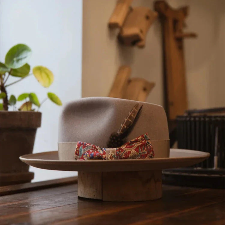 A stylish wool top hat with a conical crown design, providing sun protection and a touch of European elegance.