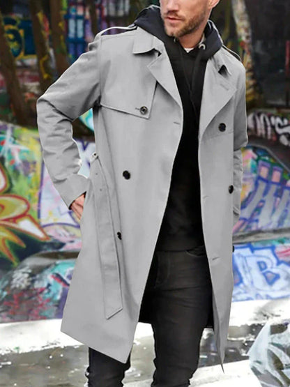 Stylish men's double-breasted trench coat in light gray color with slim fit silhouette