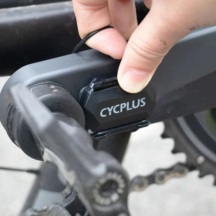 Dual-mode cadence and speed sensor for cycling, featuring Bluetooth and ANT+ connectivity, waterproof design, and extended battery life.