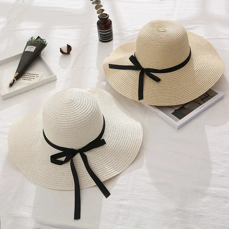 Fashionable summer straw hat for women with wide brim and bow detail, providing UV protection and stylish look