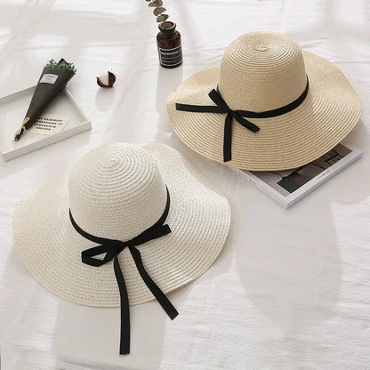 Fashionable summer straw hat for women with wide brim and bow detail, providing UV protection and stylish look