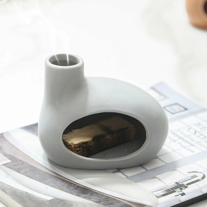 Elegant ceramic Palo Santo incense burner with a modern, conical design for optimal aroma release
