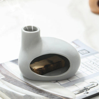 Elegant ceramic Palo Santo incense burner with a modern, conical design for optimal aroma release