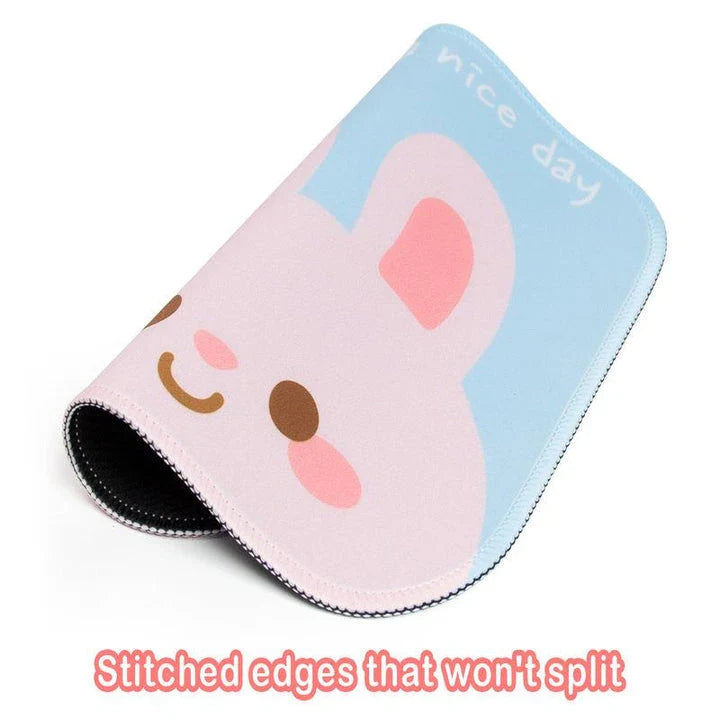 Cute animal-themed desk pad with smooth cloth surface and non-slip rubber base for precise mouse tracking and comfortable use