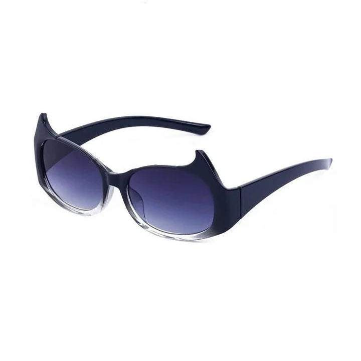 Stylish cat-eye sunglasses with oversized frames, semi-rimless design, and punk-inspired detailing for a timeless, glamorous look