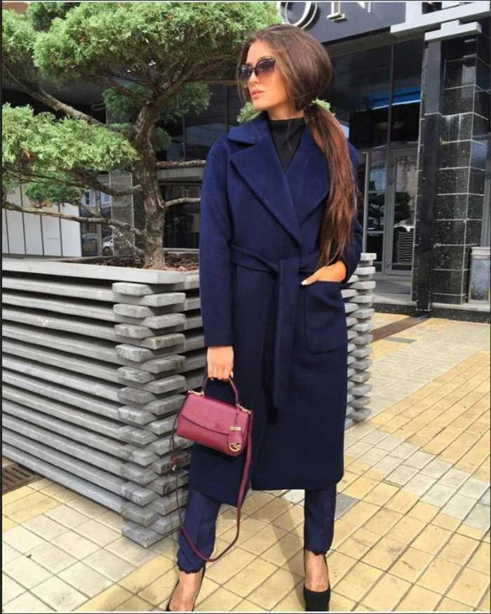 Navy blue woolen coat with a lapel tie accent, perfect for elevating any outfit