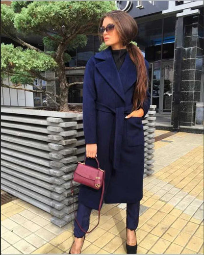 Navy blue woolen coat with a lapel tie accent, perfect for elevating any outfit