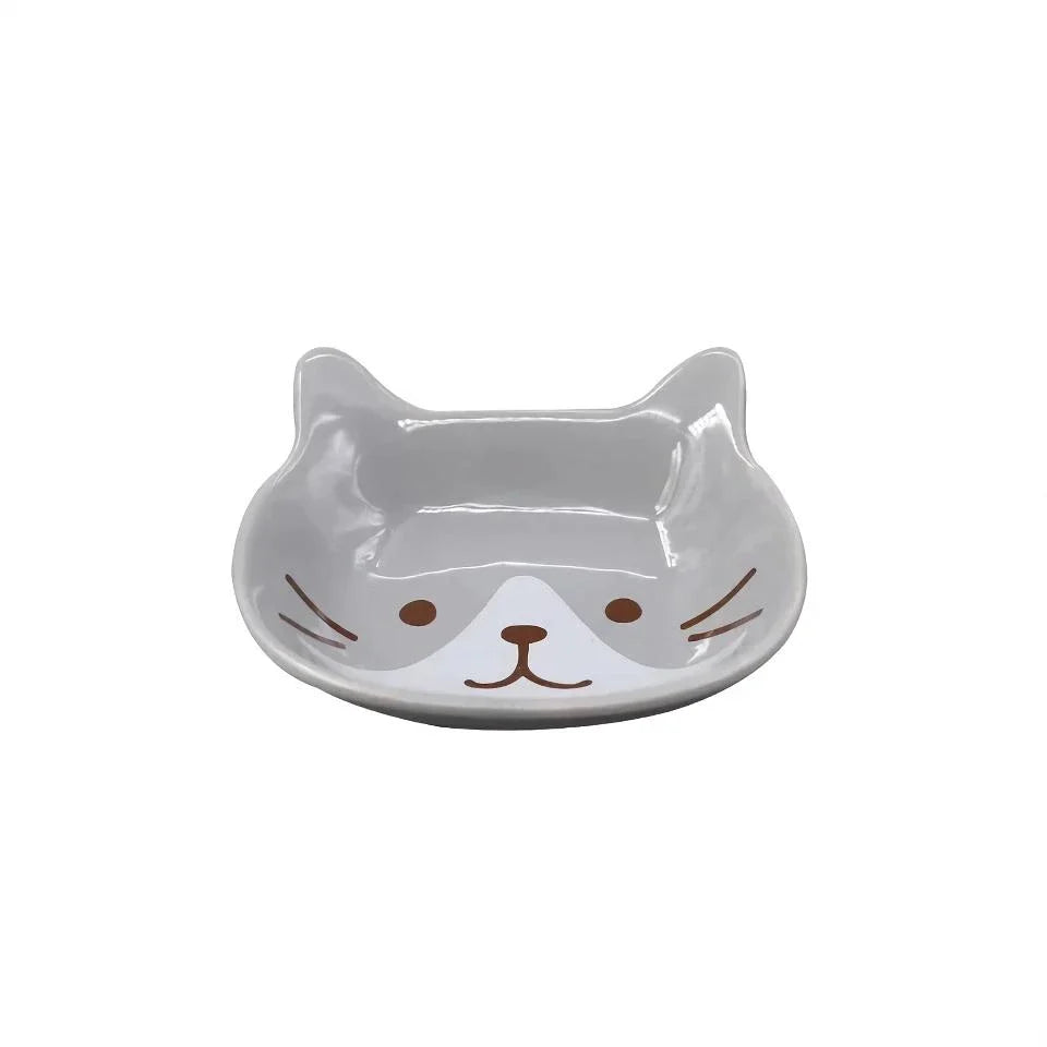 A charming Japanese-style ceramic dish featuring a cute cat design, perfect for serving sauces, dips, and small portions in style.