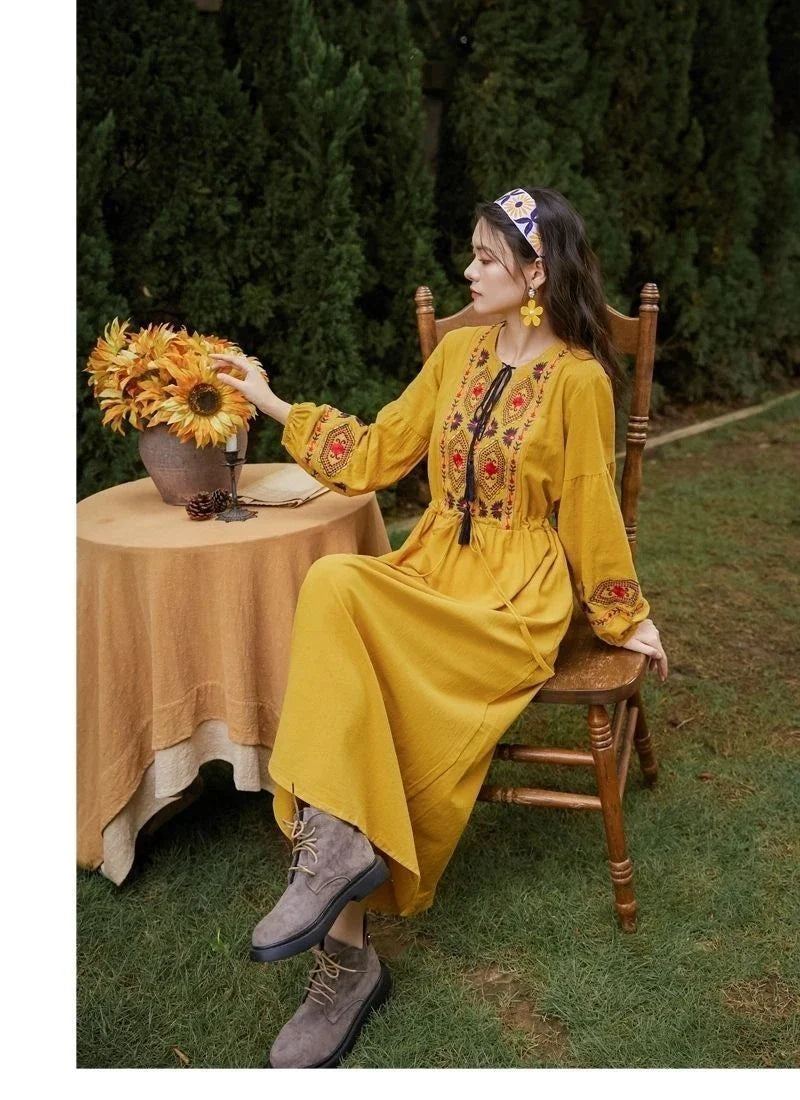 Elegant embroidered cotton-linen dress with tassels, featuring a waist-cinching A-line silhouette in vibrant colors