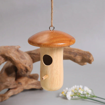 A decorative wooden hummingbird nest with a classic rustic design, perfect for attracting and providing a cozy retreat for hummingbirds in your outdoor garden.