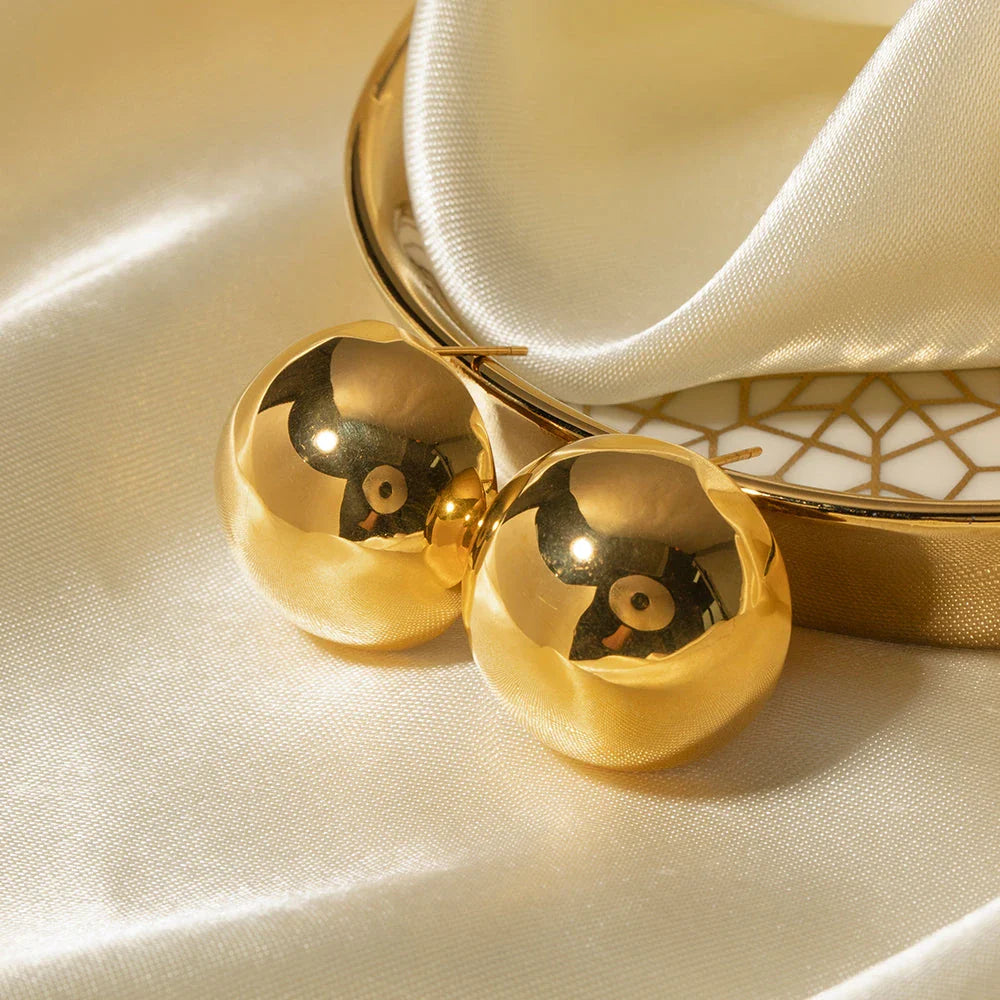 Elegant 18K gold-plated cutout earrings with a sleek hemispherical design, perfect for formal events and everyday wear.