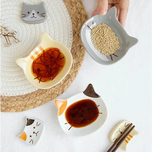 A charming Japanese-style ceramic dish featuring a cute cat design, perfect for serving sauces, dips, and small portions in style.