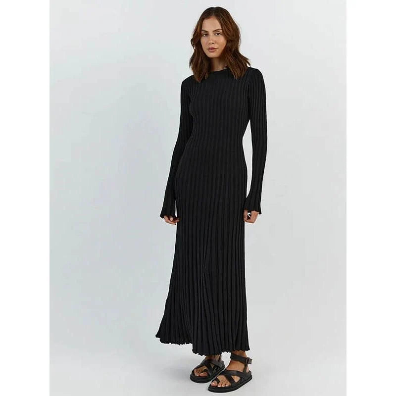 Timeless elegant pleated knit dress in black, perfect for summer office wear with a sophisticated and comfortable design.