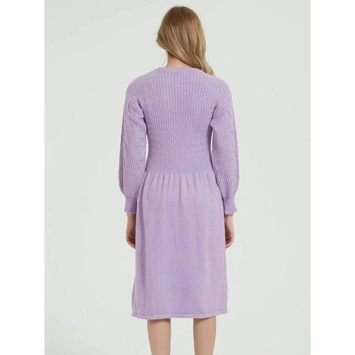 Elegant long sleeve knitted sweater dress in purple red with a classic A-line silhouette and mid-calf length