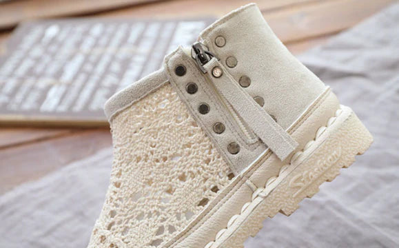 Flat-soled women's Martin boots in grey and beige colors, featuring a denim upper and rubber sole for comfortable, everyday wear.