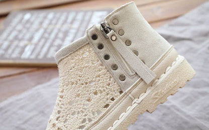 Flat-soled women's Martin boots in grey and beige colors, featuring a denim upper and rubber sole for comfortable, everyday wear.