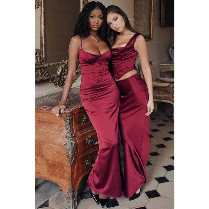 Elegant satin two-piece formal skirt set with backless crop top and ankle-length skirt in a sophisticated wine color