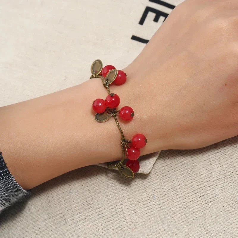 Boho vintage-inspired cherry coin bracelet with adjustable lobster-claw clasp, perfect for girls' summer fashion