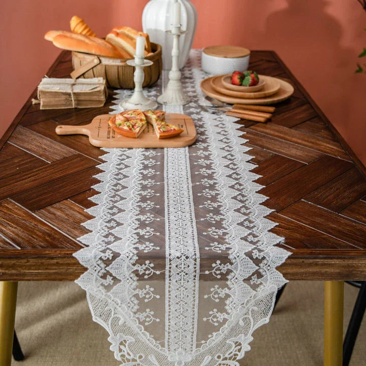 Elegant and refined lace table runner with intricate embroidery and hollowed-out patterns, perfect for sophisticated dining experiences