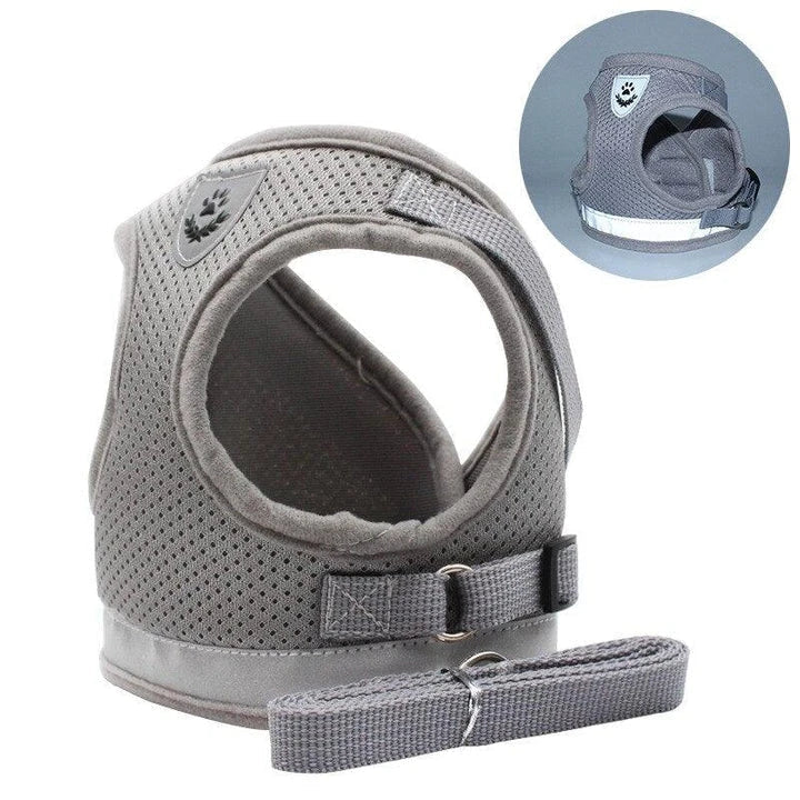 Reflective and breathable pet harness in blue color with adjustable straps and mesh design for safety and comfort