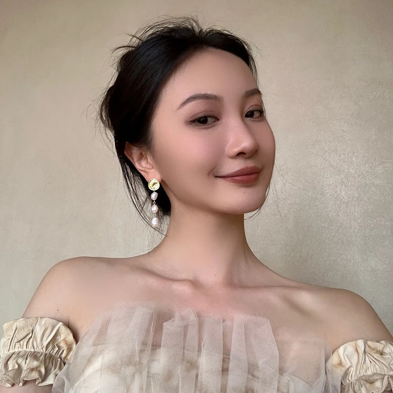 Elegant gold coin long earrings with a luxurious, statement-making design