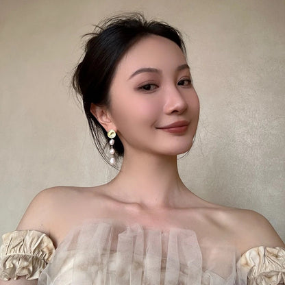 Elegant gold coin long earrings with a luxurious, statement-making design