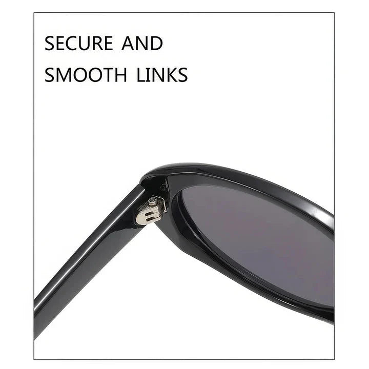 Chic oval sunglasses with white grey acetate frames and polycarbonate lenses, designed for fashionable women to shield their eyes from UV rays in style.