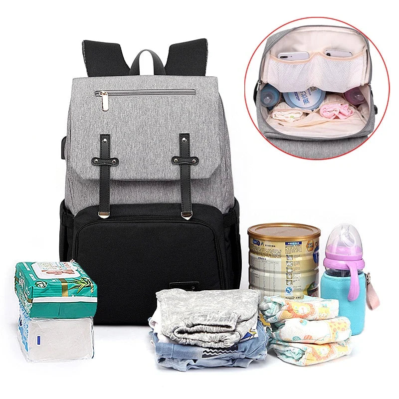 Premium diaper backpack with insulated pockets, stroller attachment, and USB charging port