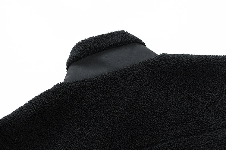 A cozy and stylish men's fleece jacket with a standing collar and convenient side pockets, available in a range of classic colors.