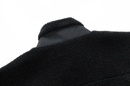 A cozy and stylish men's fleece jacket with a standing collar and convenient side pockets, available in a range of classic colors.