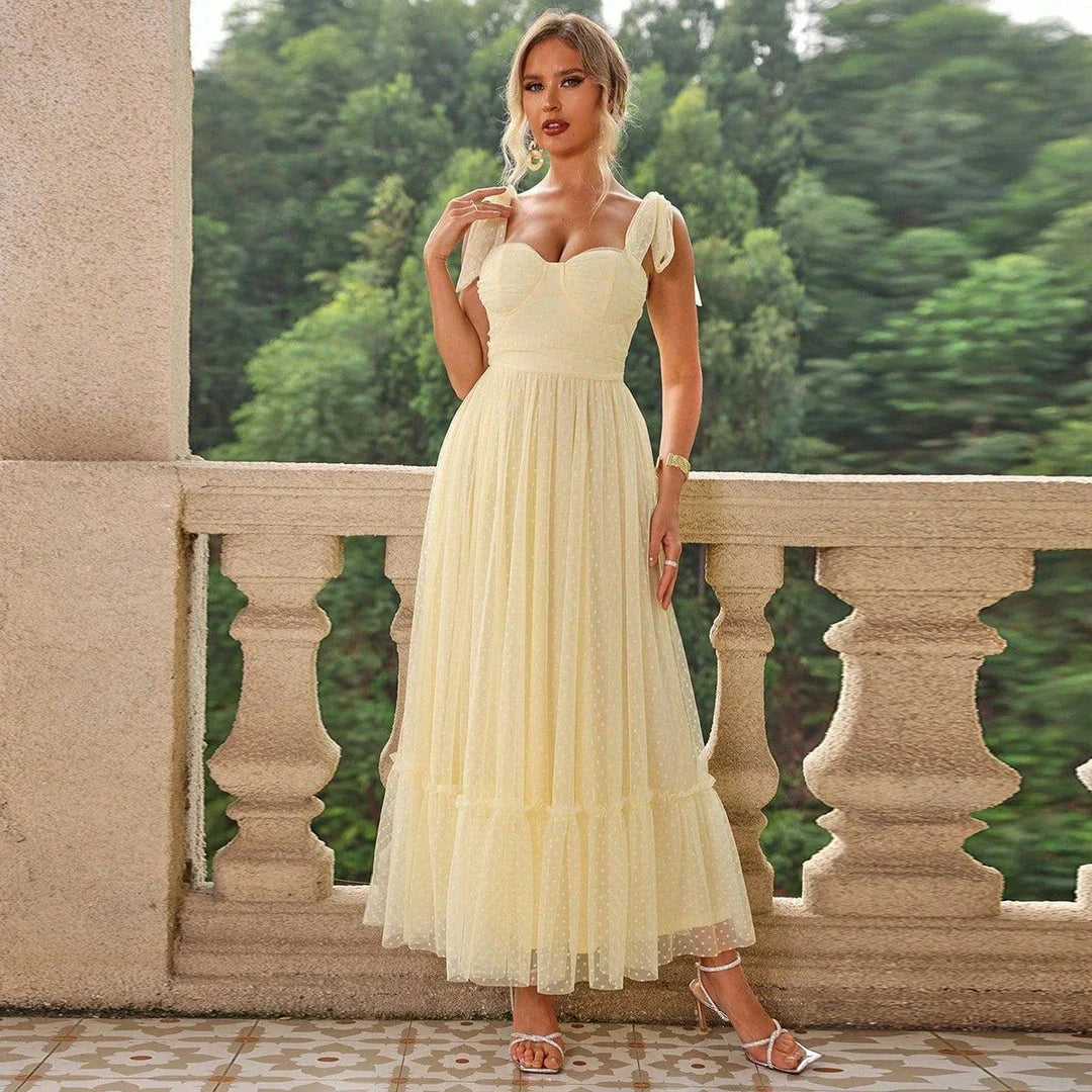 Fairy-inspired dress with mid-length silhouette, lace-up details, and luxurious polyester fabric