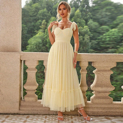 Fairy-inspired dress with mid-length silhouette, lace-up details, and luxurious polyester fabric