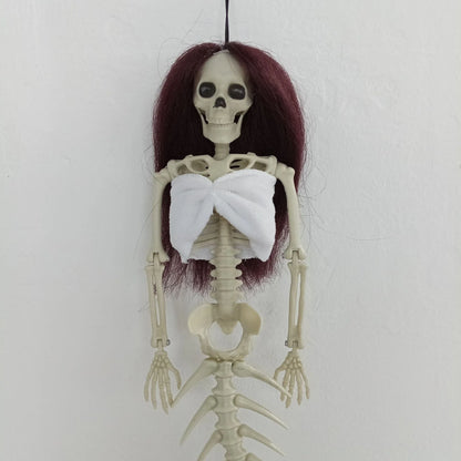 Mermaid bone pendant in various colors, including brown, dark purple, burgundy, and lake blue, hanging outdoors for Halloween decoration