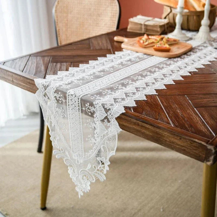 Elegant and refined lace table runner with intricate embroidery and hollowed-out patterns, perfect for sophisticated dining experiences
