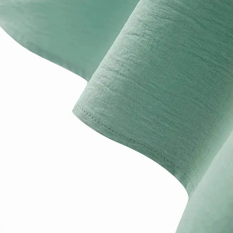 Elegant polyester dress with long sleeves, high slit hem, and available in caramel, black, blue, green, and pink colors