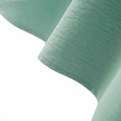 Elegant polyester dress with long sleeves, high slit hem, and available in caramel, black, blue, green, and pink colors