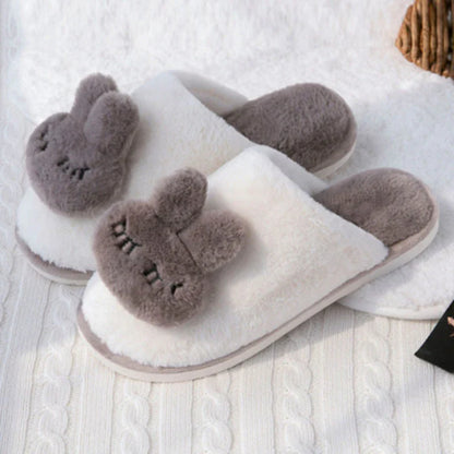 Cozy cotton slippers in a soft pink color, featuring a plush, non-slip design for comfortable home wear