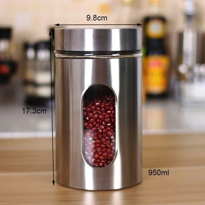 Stainless steel and glass spice jars in various sizes with airtight lids, perfect for organizing and preserving spices in a modern kitchen.