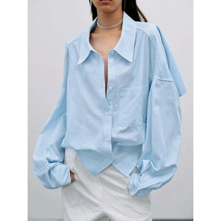 Chic patchwork blouse with functional pockets, perfect for casual and semi-formal occasions