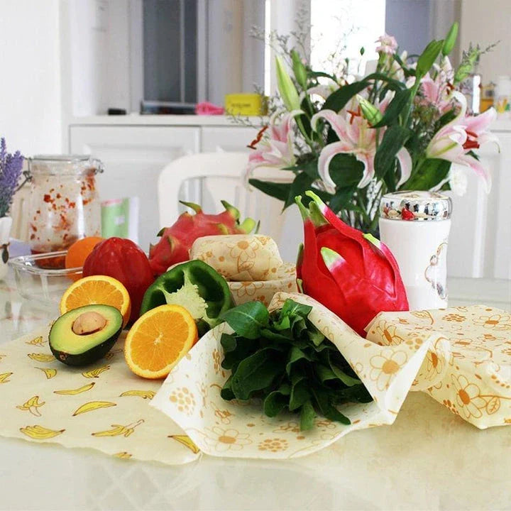 Reusable beeswax food wrap film in a variety of floral patterns, including yellow, green, beige, and white