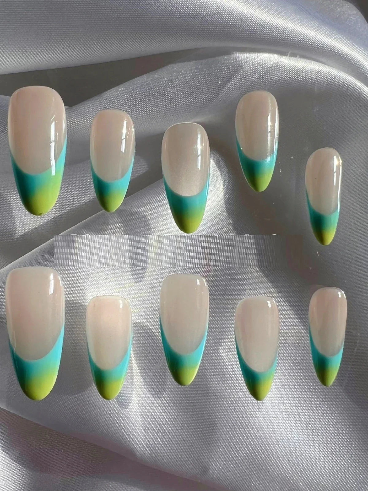 Handmade premium almond-based nail armor with a French manicure design, available in custom-fitted sizes and a macaron-inspired color palette