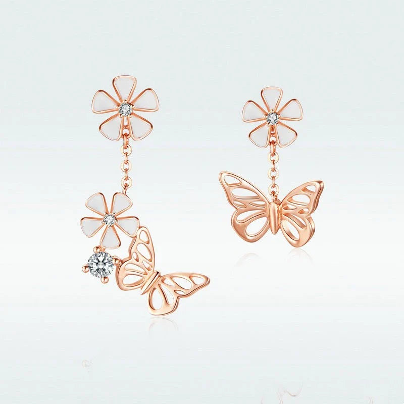 Elegant silver earrings featuring a delicate butterfly design with shimmering white crystals