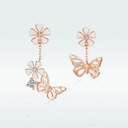 Elegant silver earrings featuring a delicate butterfly design with shimmering white crystals