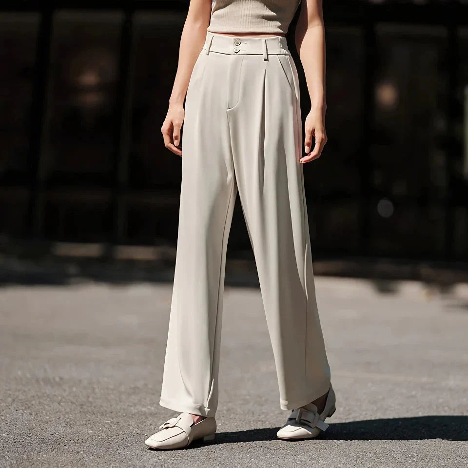 Effortless wide-leg summer trousers for women in white, featuring a relaxed fit, breathable cotton fabric, and functional pockets