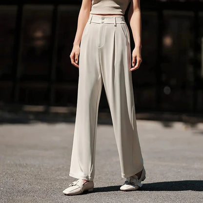 Effortless wide-leg summer trousers for women in white, featuring a relaxed fit, breathable cotton fabric, and functional pockets