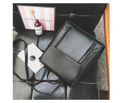 Versatile British-inspired shoulder bag made from high-quality PU leather with a spacious main compartment, convenient pockets, and an adjustable strap