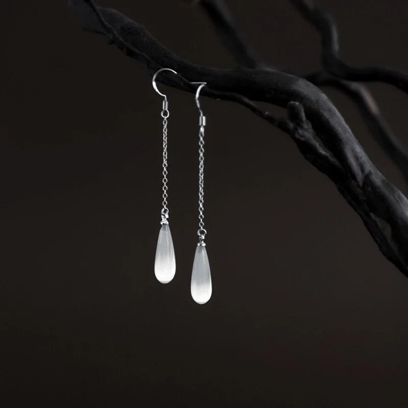 925 Sterling Silver Opal Drop Earrings with a sleek and sophisticated design, perfect for adding a touch of elegance to any outfit.