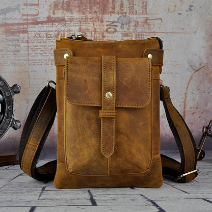 A premium cowhide leather shoulder bag with a compact and versatile design, suitable for various occasions and outdoor activities.