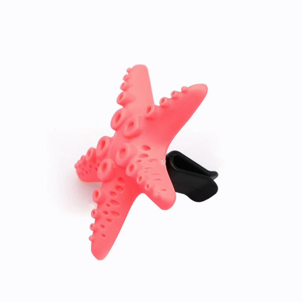 Cute mini starfish car vent air freshener in a rosy-pink color, emitting a refreshing cherry scent
